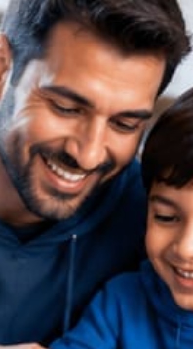 A father and child building a game together
